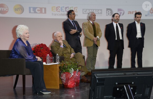 Pierre Bergé et Line Renaud, Jean-Luc Hess, Denis Olivennes lors de la soirée de lancement de la campagne 2014 du Sidaction au Musée du Quai Branly à Paris, le 10 mars 2014.