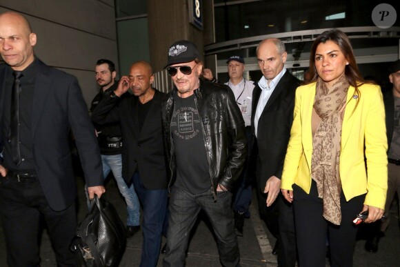 Johnny Hallyday à son arrivée à l'aéroport de Roissy Charles de Gaulle le 11 mars 2014. Le taulier, arrivé seul, est à Paris pour la promotion du film de Claude Lelouch "Salaud, on t'aime".