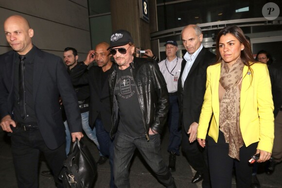 Johnny Hallyday à son arrivée à l'aéroport de Roissy Charles de Gaulle le 11 mars 2014. Le taulier, arrivé seul, est à Paris pour la promotion du film de Claude Lelouch "Salaud, on t'aime".