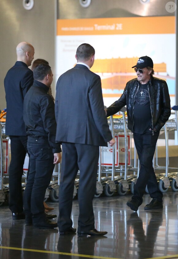 Johnny Hallyday à son arrivée à l'aéroport de Roissy Charles de Gaulle le 11 mars 2014. Le taulier, arrivé seul, est à Paris pour la promotion du film de Claude Lelouch "Salaud, on t'aime".