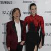 Mick Jagger et sa compagne L'Wren Scott au Harper's Bazaar Women of The Year à Londres. Le 5 novembre 2013