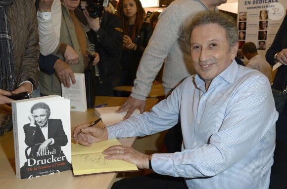Michel Drucker à la 34e édition du Salon du Livre à Paris, Porte de Versailles, le 22 mars 2014.