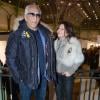Gérard Darmon et Sarah Guetta la coiffeuse des stars à l'inauguration de l'exposition "Art Paris Art Fair" au Grand Palais, à Paris le 26 mars 2014.