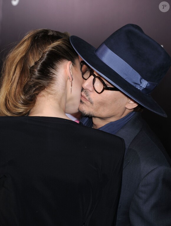 Johnny Depp et sa fiancée Amber Heard lors de l'avant-première du film 3 Days To Kill à Los Angeles le 12 février 2014