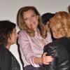 Valérie Trierweiler entre Saïda Jawad et Nicoletta lors du gala de clôture du Don'actions du Secours Populaire au Musée des Arts Forains à Paris, le 28 mars 2014