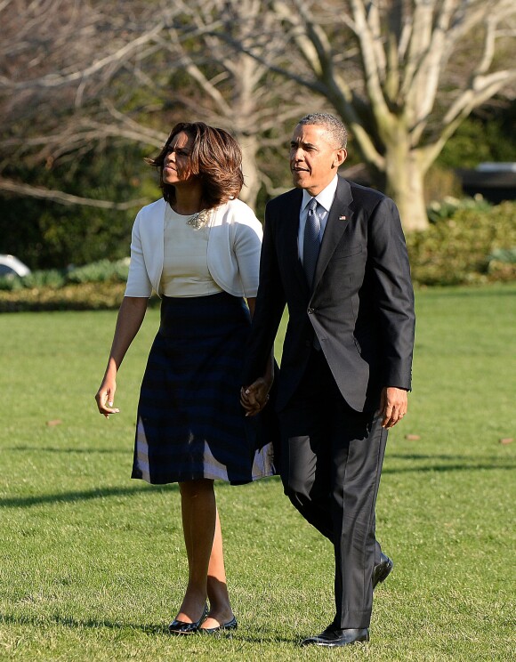 Le président Barack Obama et Michelle de retour à la Maison Blanche à Washington après avoir assisté à Austin (Texas) à un sommet pour commémorer le 50e anniversaire de la signature du Cival Rights Act de 1964. Le 10 avril 2014.