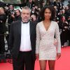 Luc Besson et sa femme Virginie Silla lors de la montée des marches du film Saint Laurent et l'hommage au cinéma d'animation, durant le Festival de Cannes le 17 mai 2014