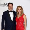 John Travolta et sa femme Kelly Preston - Photocall du 21e gala de l'amfAR à l'Eden Roc au Cap d'Antibes en marge du 67e Festival du film de Cannes, le 22 mai 2014.