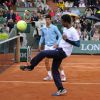 Novak Djokovic et Gaël Monfils lors de la journées des Enfants de Roland-Garros, à Roland-Garros, le 24 mai 2014 à Paris