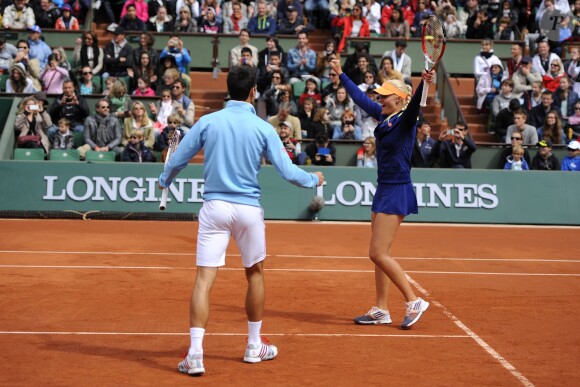 Novak Djokovic et Kristina Mladenovic lors de la journées des Enfants de Roland-Garros, à Roland-Garros, le 24 mai 2014 à Paris