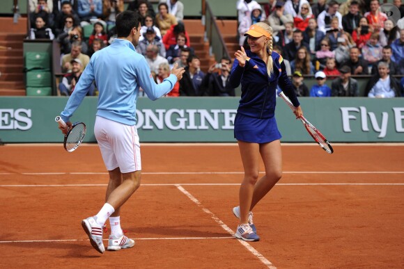Novak Djokovic et Kristina Mladenovic lors de la journées des Enfants de Roland-Garros, à Roland-Garros, le 24 mai 2014 à Paris