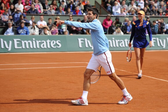 Novak Djokovic et Kristina Mladenovic lors de la journées des Enfants de Roland-Garros, à Roland-Garros, le 24 mai 2014 à Paris