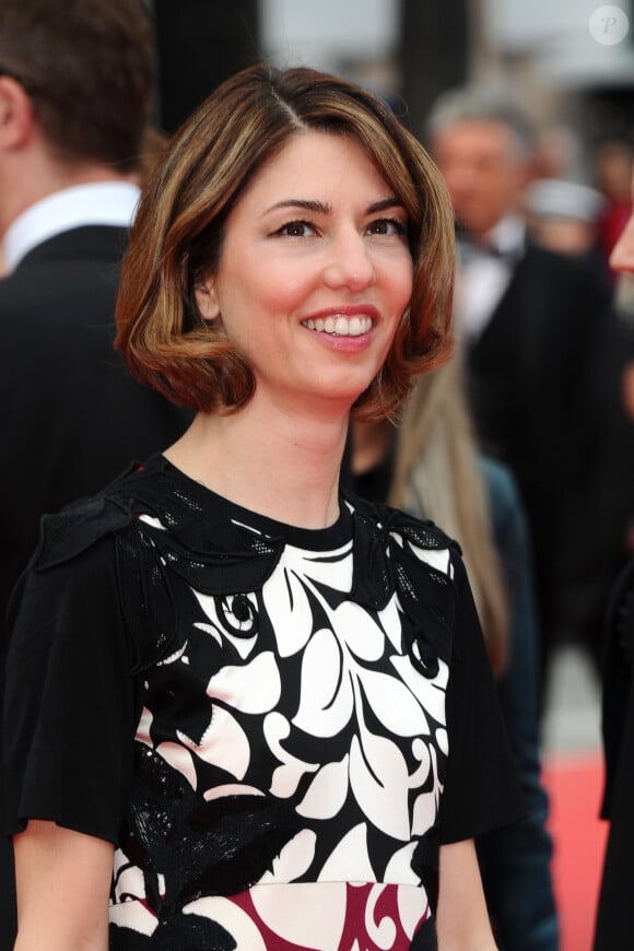 Sofia Coppola (robe Marc Jacobs - la même que Drew Barrymore a porté lors de sa dernière grossesse) lors de la dernière montée des marches du Festival de Cannes 2014