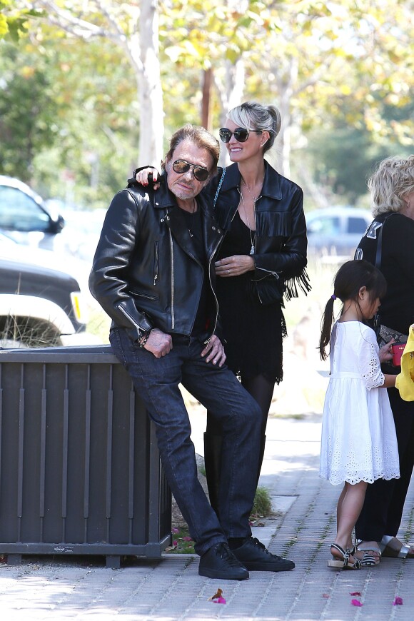 Johnny Hallyday et sa femme Laeticia à Malibu, le 25 mai 2014.