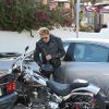 Johnny Hallyday, sa femme Laeticia et leurs filles Jade et Joy sont allés déjeuner au restaurant Taverna Tony à Malibu, le 25 mai 2014. Johnny est ensuite allé faire du shopping chez John Varvatos puis est reparti au volant de sa Harley Davidson