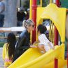Laeticia Hallyday est allée passer un moment avec ses filles Jade et Joy dans un parc à Malibu. Les filles étaient très en joie....à chaque passage sur le toboggan, elles embrassaient leur mère. Le 25 mai 2014.