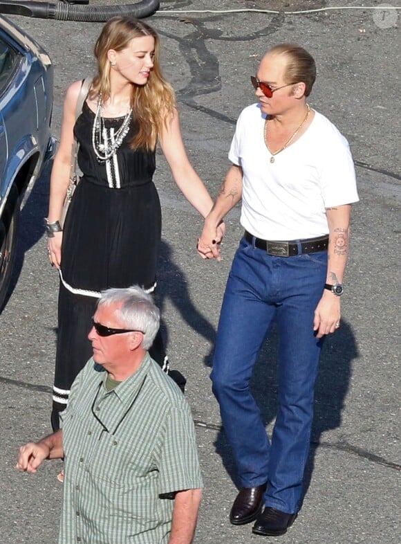 Johnny Depp et sa fiancée Amber Heard sur le tournage du film "Black Mass" à Boston, le 2 juin 2014.