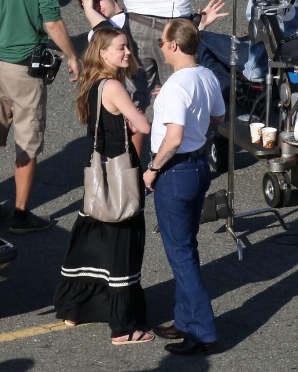Johnny Depp et sa fiancée Amber Heard sur le tournage du film "Black Mass" à Boston, le 2 juin 2014.