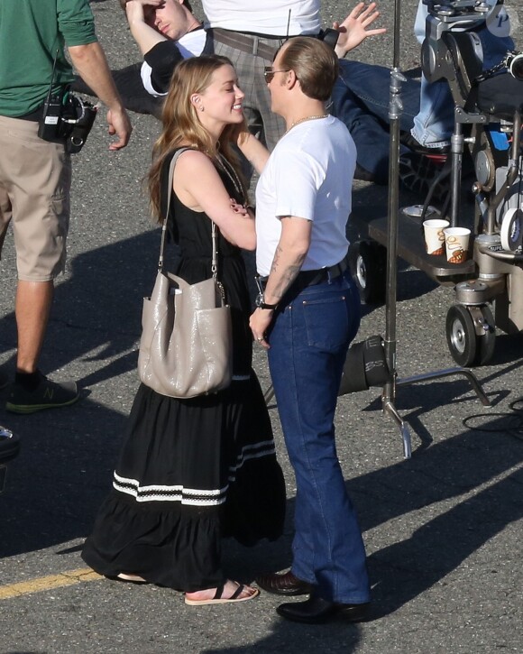 Johnny Depp et sa fiancée Amber Heard sur le tournage du film "Black Mass" à Boston, le 2 juin 2014.