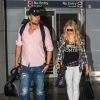 La chanteuse Fergie et son mari Josh Duhamel arrivent à l'aéroport de JFK à New York, le 9 juin 2014.