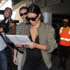 Kim Kardashian de retour à l'aéroport de Los Angeles, le 19 juin 2014.