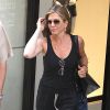 Jennifer Aniston quitte Barney à New York, Madison Avenue, New York, le 24 juin 2014.