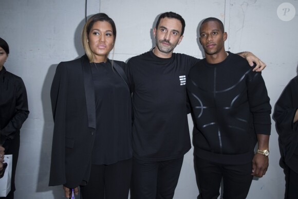 Riccardo Tisci et Victor Cruz et Elaina Watley - Défilé Givenchy homme collection printemps-été 2015 à la Halle Freyssinet à Paris, le 27 juin 2014.