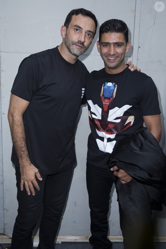 Riccardo Tisci et Salim Kechiouche - Défilé Givenchy homme collection printemps-été 2015 à la Halle Freyssinet à Paris, le 27 juin 2014.