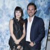 Delphine McCarty et Christophe Michalak assistent au défilé haute couture Alexis Mabille automne-hiver 2014-2015 à l'hôtel d'Évreux. Paris, le 7 juillet 2014.