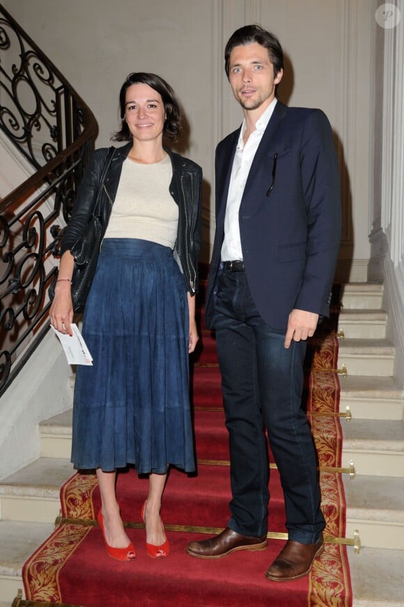 Audrey Ismael et Raphaël Personnaz assistent au défilé haute couture Alexis Mabille automne-hiver 2014-2015 à l'hôtel d'Évreux. Paris, le 7 juillet 2014.