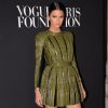 Kendall Jenner, ultrastylée en robe et bottines Balmain (collection automne-hiver 2014-15), assiste au gala de la Vogue Paris Foundation au Palais Galliera. Paris, le 9 juillet 2014.