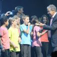 Pierre Perret sur la scène de l'Olympia à Paris, pour ses 80 ans, le 9 juillet 2014.