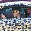 Exclusif - Justin Bieber et Yovanna Ventura se promènent dans les rues de Los Angeles dans une Audi R8 au motif panthère. Le 9 juillet 2014.