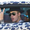 Exclusif - Justin Bieber et  Yovanna Ventura se promènent dans les rues de Los Angeles dans une Audi R8 au motif panthère. Le 9 juillet 2014.
