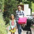 Jessica Alba, son mari Cash Warren et leurs filles Honor et Haven se rendent à une fête à Los Angeles. Le 19 juillet 2014