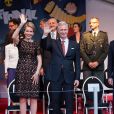  Le roi Philippe et la reine Mathilde de Belgique, enjoués et complices, ont assisté au bal populaire organisé place du jeu de balles à Bruxelles le 20 juillet 2014, à la veille de la fête nationale. 