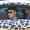 Exclusif - Justin Bieber se promène dans les rues de Los Angeles dans une Audi R8 au motif panthère. Le 9 juillet 2014.