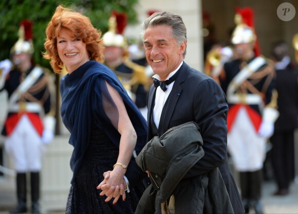 Gérard Holtz et son épouse Muriel Mayette au palais de l'Elysée, lors d'un dîner en l'honneur de la reine Elizabteh II, à Paris le 6 juin 2014