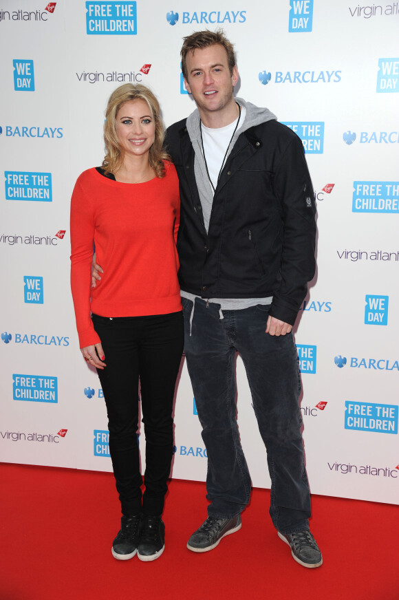 Holly Branson et son mari Fred Andrews lors de l'événement "We Day UK" au stade de Wembley à Londres, le 7 mars 2014.
