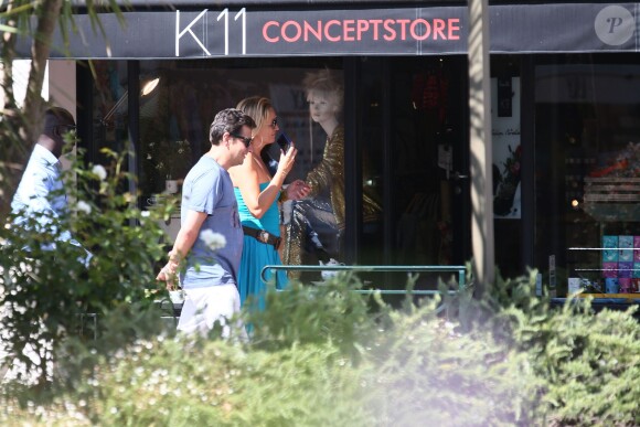 Exclusif - Laurent Gerra et sa compagne Christelle Lyon se promènent dans les rues de Saint-Tropez le 7 août 2014.