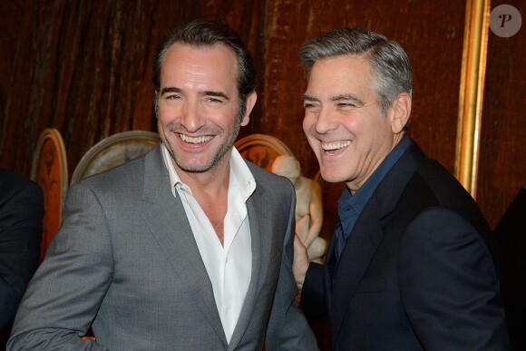 Jean Dujardin et George Clooney à Paris, le 12 février 2014.