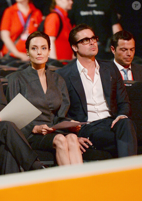 Angelina Jolie et Brad Pitt lors d'une conférence pour la prévention contre les violences sexuelles lors des conflits à Londres, le 13 juin 2014. Le mariage du couple a eu lieu en France le 23 août 2014.