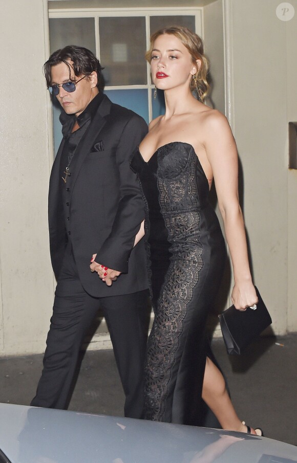 Johnny Depp et sa bombe de fiancée Amber Heard quittent les GQ awards à Londres le 3 septembre 2014.