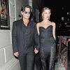 Johnny Depp et Amber Heard quittent les GQ awards à Londres le 3 septembre 2014.