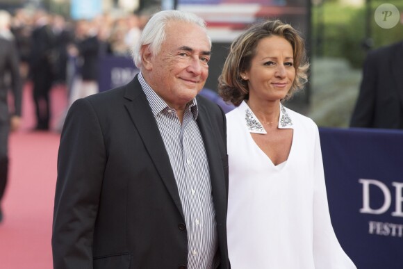Dominique Strauss-Kahn et sa compagne Myriam L'Aouffir - Avant-première du film "Sin City" lors du 40ème festival du cinéma américain de Deauville, le 13 septembre 2014. 