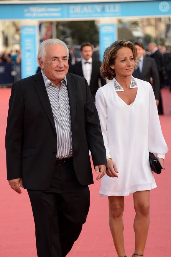 Dominique Strauss-Kahn et sa ravissante compagne Myriam L'Aoufir au festival de Deauville le 13 septembre 2014.