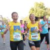 Fabienne Carat et sa soeur lors de la course "La Parisienne 2014" pour la lutte contre le cancer, au Champs de Mars à Paris, le 14 septembre 2014