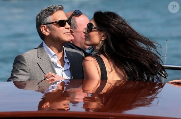 George Clooney et sa fiancée Amal Alamuddin arrivant à Venise le 26 septembre 2014 où ils vont célébrer leur mariage civil, prévu lundi 29 septembre.