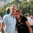 Laurent Petitguillaume et Martine Boukobza, présidente de l'association "MeghanOra"  lors du 2e tournoi de pétanque de l'association sur l'Esplanade des Invalides à Paris, le 28 septembre 2014 