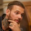 Le chanteur M Pokora a reçu des mains du maire de Strasbourg Roland Ries la médaille d'honneur de la ville, lors d'une cérémonie organisée en présence de fans à l'hôtel de ville de Strasbourg, le 12 février 2014, ville d'où il est originaire.